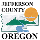 Jefferson County logo has outline of county with shape of sun, mountain and river running through.